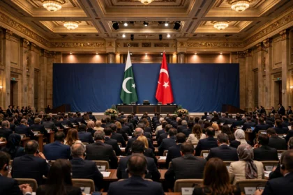 Delegates seated in a grand conference hall in Istanbul with the flags of Pakistan and Turkiye displayed on stage during the International Justice Summit 2026