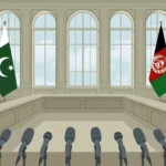An editorial illustration of the Pakistan and Afghanistan flags facing each other across an empty diplomatic negotiating table, with a row of press microphones in the foreground, October 2026